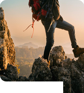 Traveller climbing in a mountain landscape