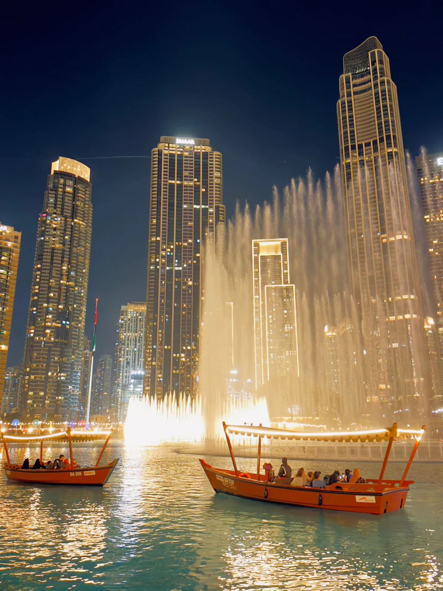 Dubai city lights and waterfront fountains